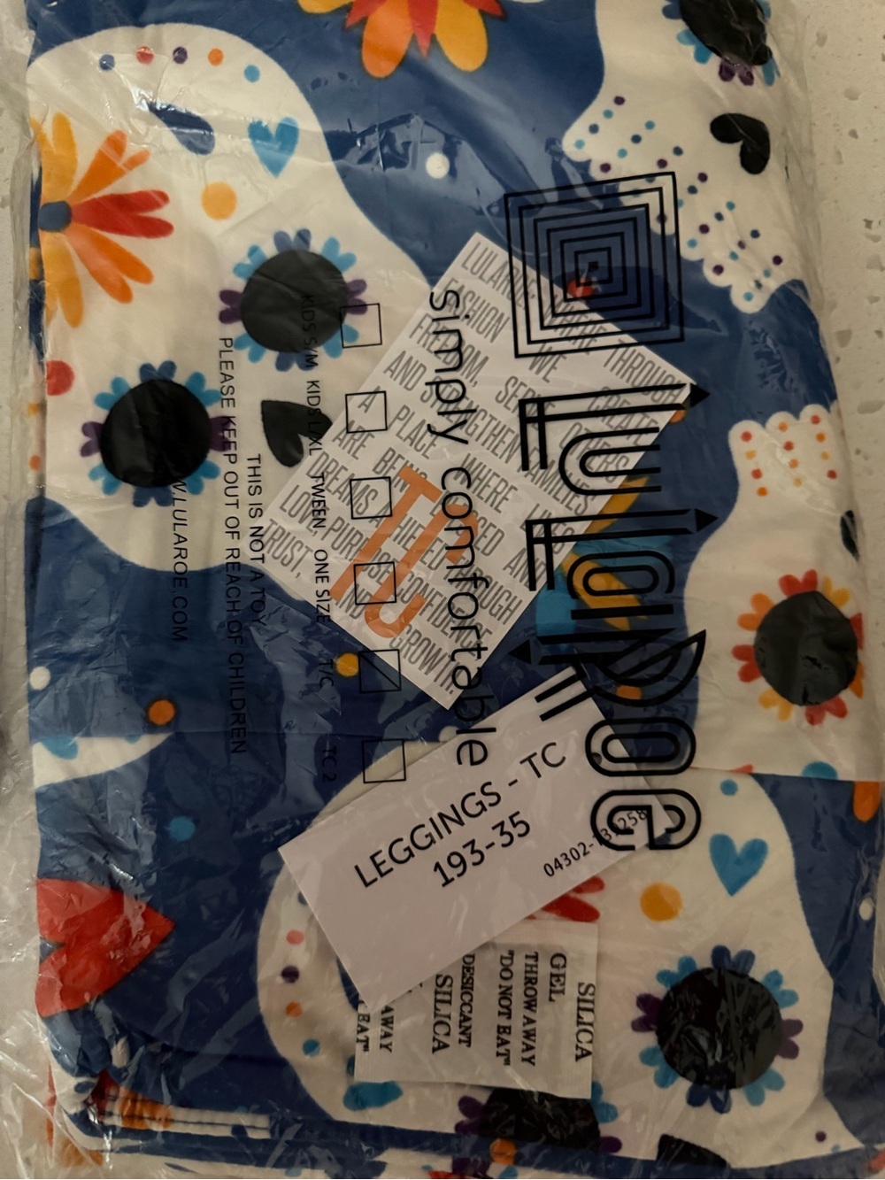 LuLaRoe TC Leggings Blue White Floral Skull Leggings with Orange Accents